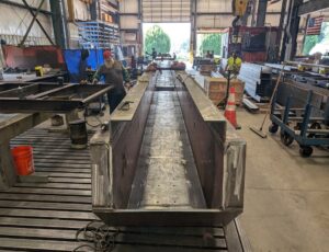 carbon steel asphalt drag slat conveyor equipment shown manufactured and ready for assembly before heading to a plant in Texas