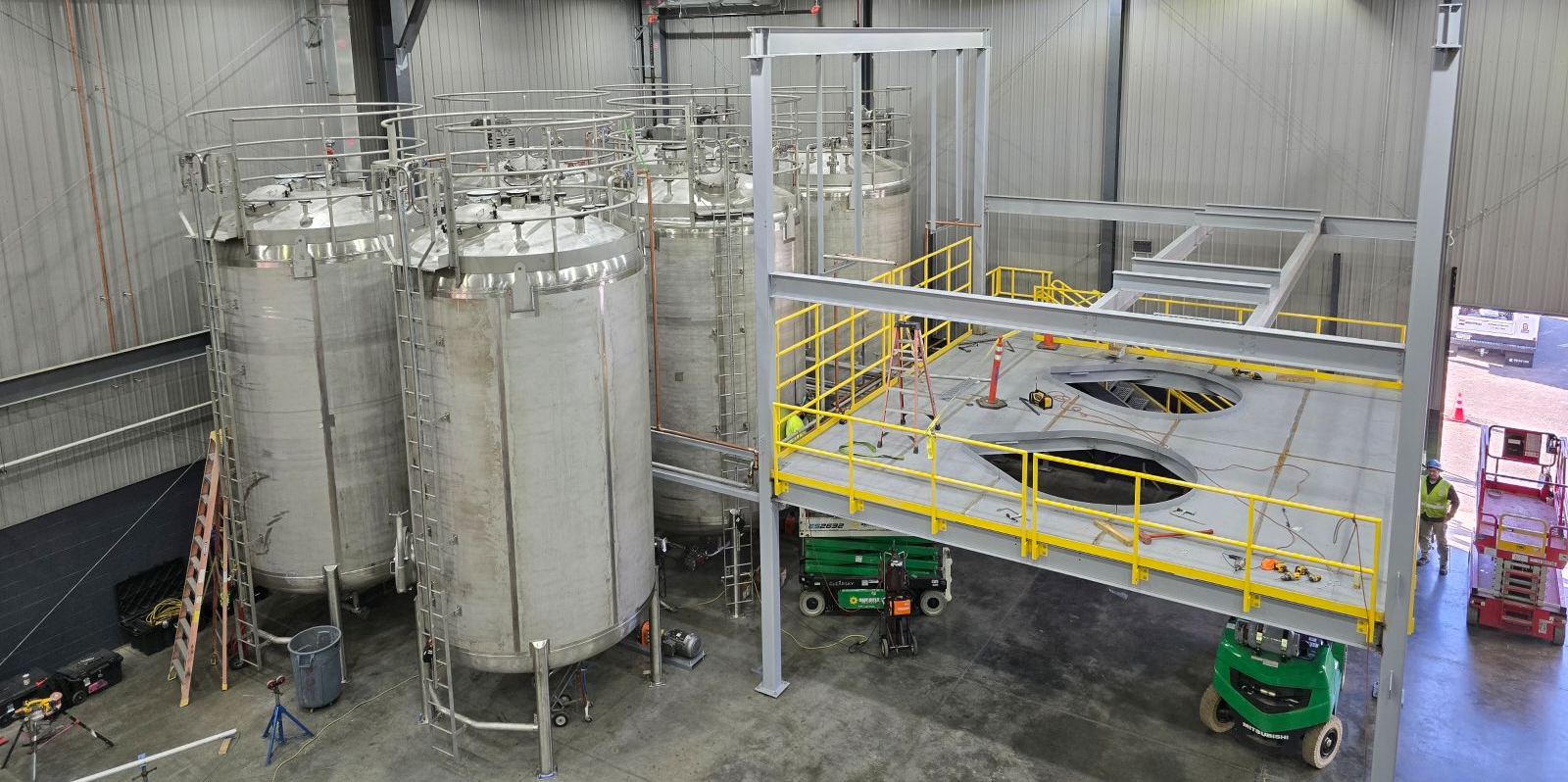 storage tanks and platforms inside of an industrial facility made by SWF Industrial's turnkey field services.